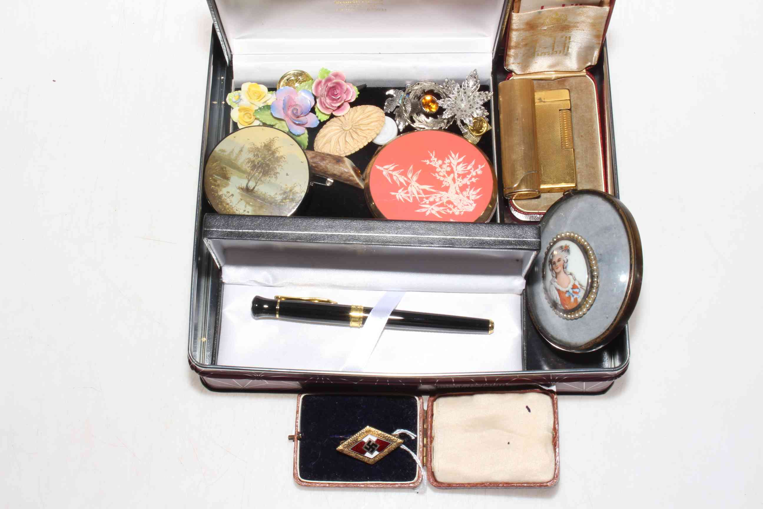 Mixed lot with Dunhill lighter, Mont Blanc biro, brooches, miniature, German enamel brooch, compact,