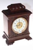 Carved walnut mantel clock with French movement by Maple & Co. Ltd Paris, 36cm.