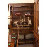 Oak three drawer potboard dresser with shelf back, 186cm by 133cm by 46cm.