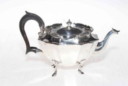 Edwardian ornate silver teapot of concave panel oval form, Birmingham 1902, 14cm high.