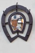 Horseshoe framed bevelled wall mirror-coat rack, 65cm by 53cm.
