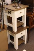 Pair oak and white two tier lamp tables.