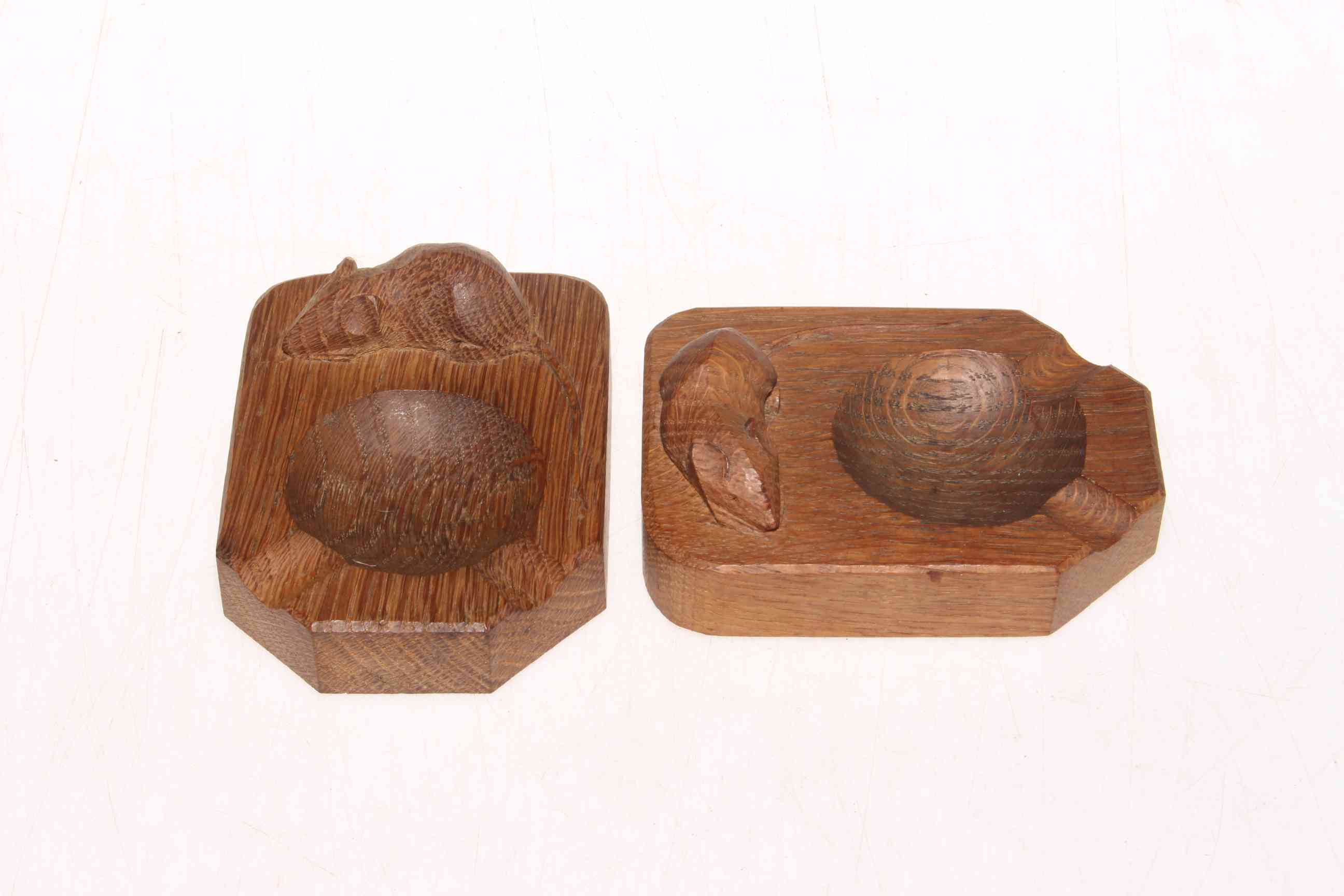 Two Robert Thompson of Kilburn 'Mouseman' oak ashtrays.