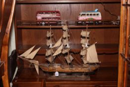 Wooden model of sailing ship and two tinplate models, VW Camper Splitty and Routemaster bus (3).