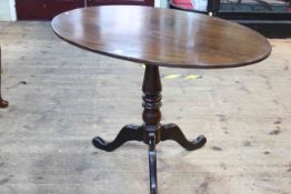 19th Century oval mahogany snap top supper table on pedestal tripod base, 73cm by 104cm by 63cm.