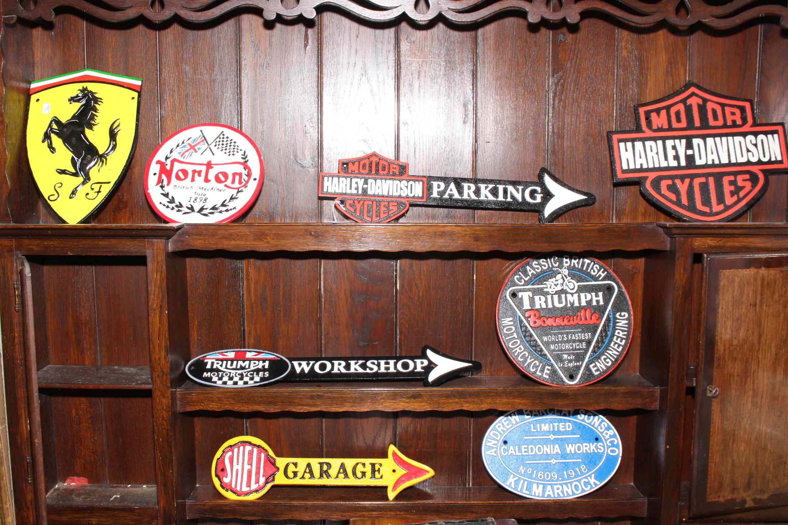 Eight cast iron motor memorabilia signs.