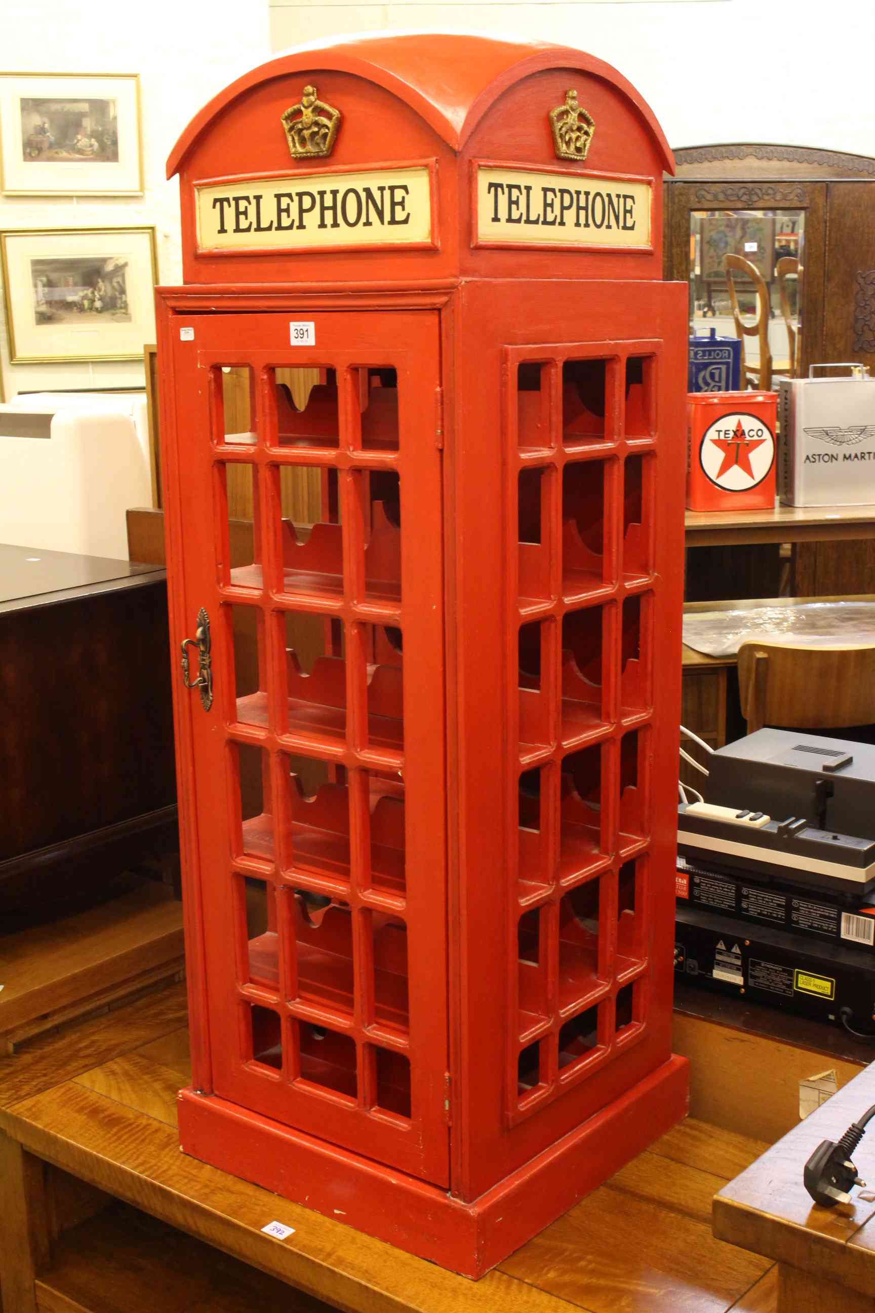 Twenty four bottle wine cabinet in the form of a vintage red telephone box, 123cm by 44cm by 44cm.