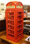 Twenty four bottle wine cabinet in the form of a vintage red telephone box, 123cm by 44cm by 44cm.