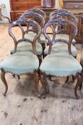 Set of six Victorian walnut/mahogany carved balloon back parlour chairs.
