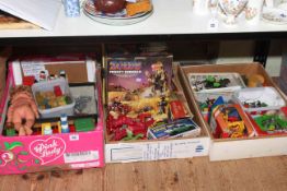 Three boxes of toys and games including German tinpate bus station, Japanese acrobatic police car,