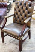 Buttoned leather Gainsborough style library chair.