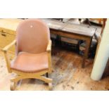 Vintage child's double school desk and early 20th Century low X-framed armchair.