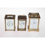 Collection of three gilt brass carriage clocks, the smallest with striking movement.