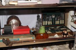 Large mantel clock, canteen of cutlery, vintage gold clubs, vintage games, glass decanter and ewer,