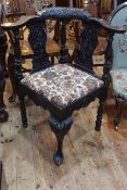 19th Century carved corner elbow chair with floral tapestry seat.