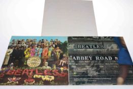 Three Beatles LP's, Abbey Road, St. Peppers, and The Beatles.