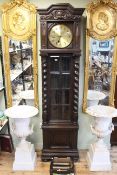 Early 20th Century carved oak triple weight longcase clock.