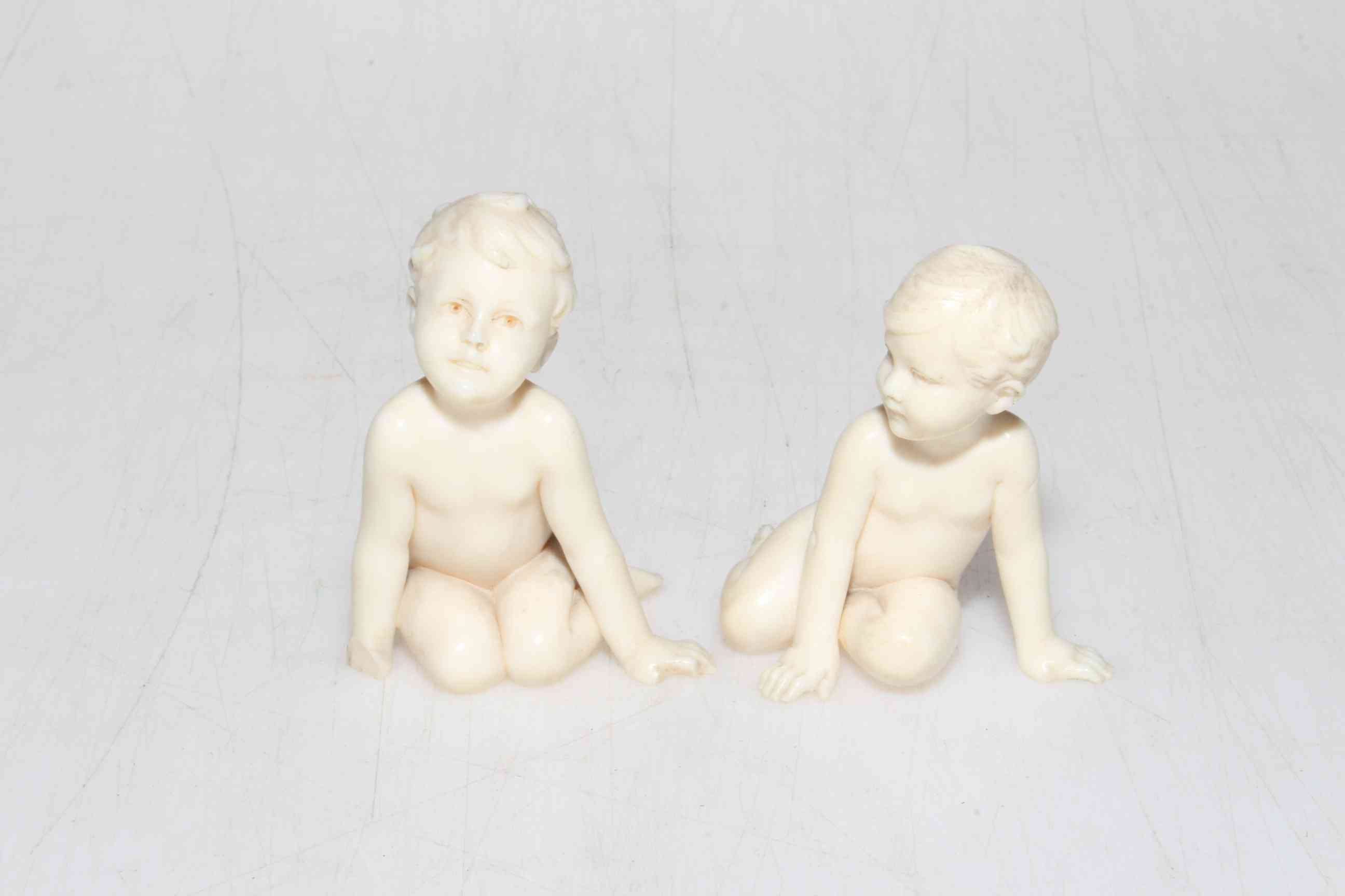 F. Preiss, two tiny ivory boy figures, one signed F.