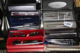 Collection of pens and biros by Parker, Sheaffer and others, approximately fifteen pieces.