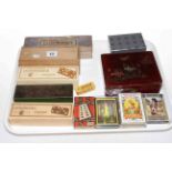 Seven boxed sets of dominoes, three packs of playing cards and ladies wristwatch.