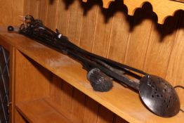 Collection of wrought iron fire irons.