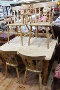 Pine turned leg kitchen table and six Windsor style chairs including pair carvers.