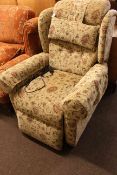 Windsor Petite electric reclining armchair in floral beige fabric.