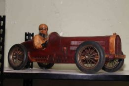 Wooden model of vintage racing car.