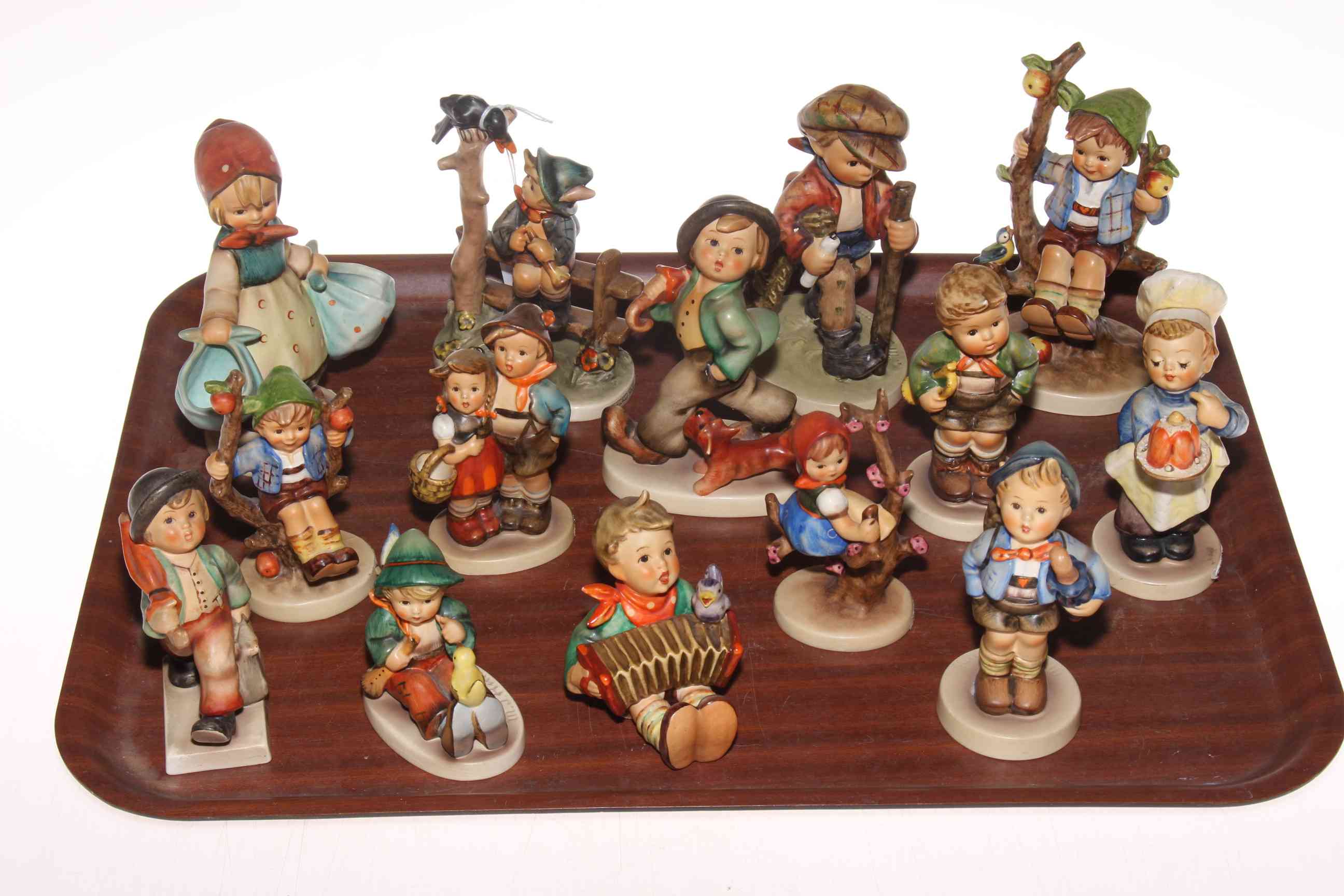 Collection of various Hummel figures.