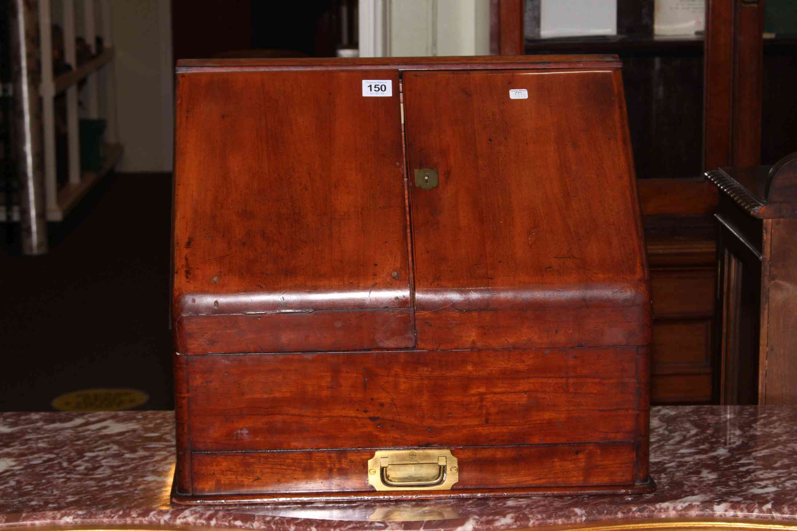 Victorian mahogany slope front stationery box with two doors enclosing calendar and fitted interior