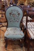 Victorian mahogany framed spoon back nursing chair in floral needlework.