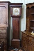 Antique oak and mahogany eight day longcase clock having square brass and silvered dial,