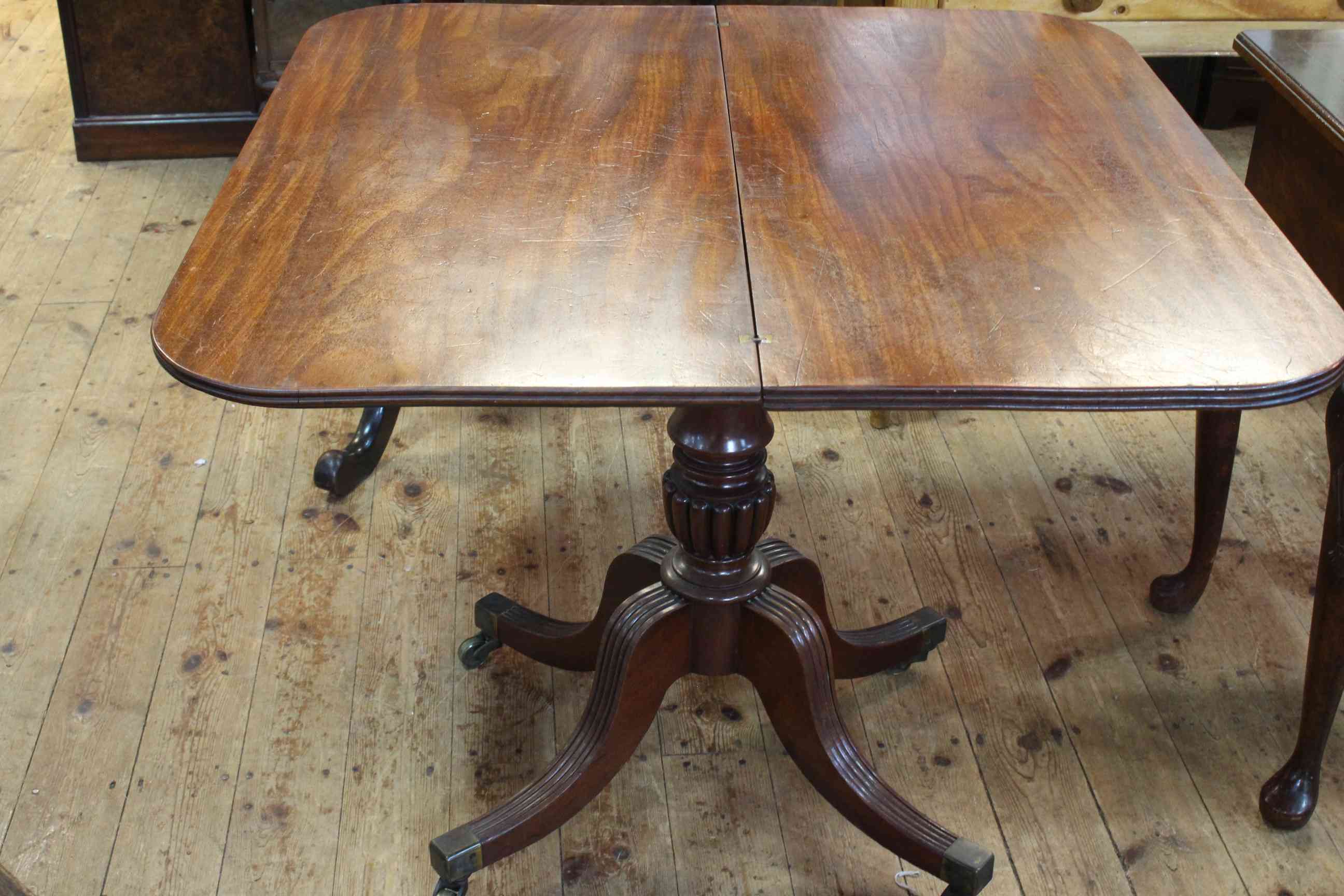 19th Century mahogany fold top tea table on turned pedestal to four reeded scrolled legs, - Image 2 of 2
