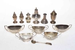 Collection of eleven silver cruets, five fluted open salts and six salt and pepper pots.
