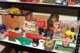 Collection of various toys including pond yachts, Mettoy typewriter, sewing machine, spinning tops,