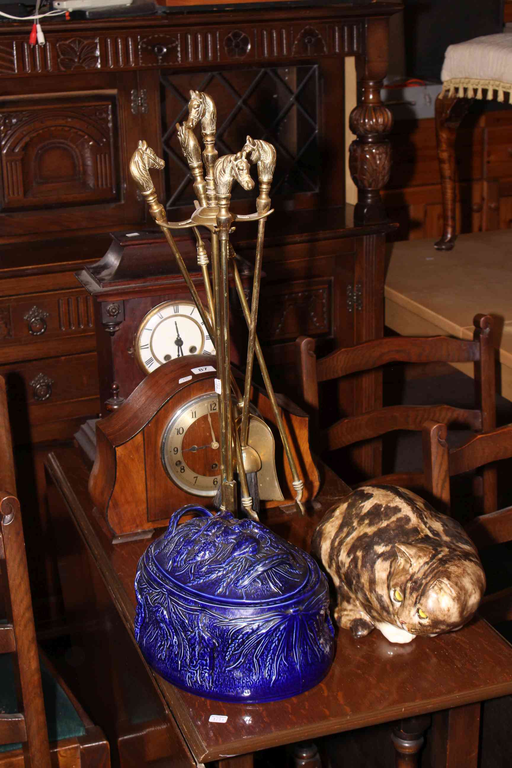 Mahogany and walnut mantel clock, brass kerb and companion set,