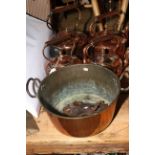 Four Victorian copper kettles, brass jam pan, and farrier's horseshoe and nails in leather holder.