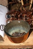 Four Victorian copper kettles, brass jam pan, and farrier's horseshoe and nails in leather holder.