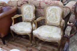 Pair French style gilt painted fauteuils in tapestry fabric.