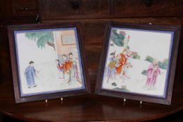 Pair Chinese porcelain polychrome plaques, each painted with figures in outdoor settings, framed,