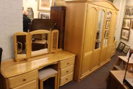 Light wood five piece bedroom suite comprising four door wardrobe, pedestal dressing table,