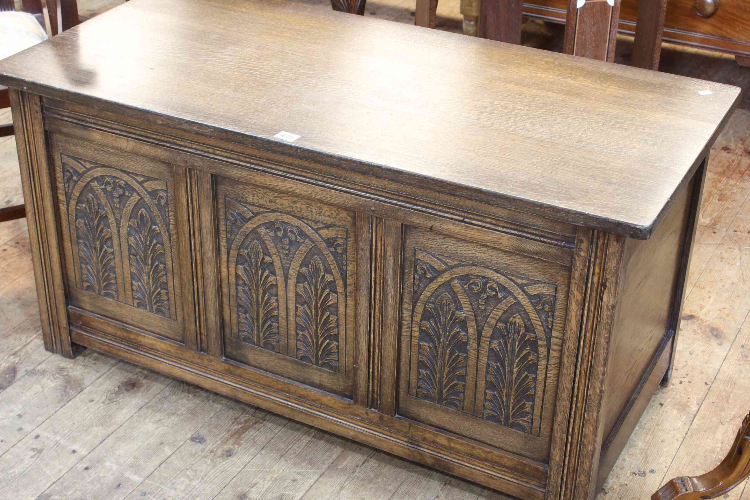 Carved oak triple panel front coffer, 53cm by 105cm by 51cm.