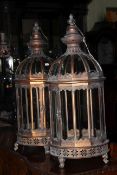 Pair of metal and glazed hanging lanterns, 60cm high.