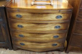 Georgian style crossbanded bow front chest having brush slide above four long drawers on bracket