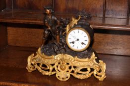 Ornate gilt mantel clock depicting a working young boy, 28cm high.