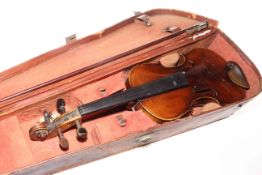 Antique mahogany violin with leather case.
