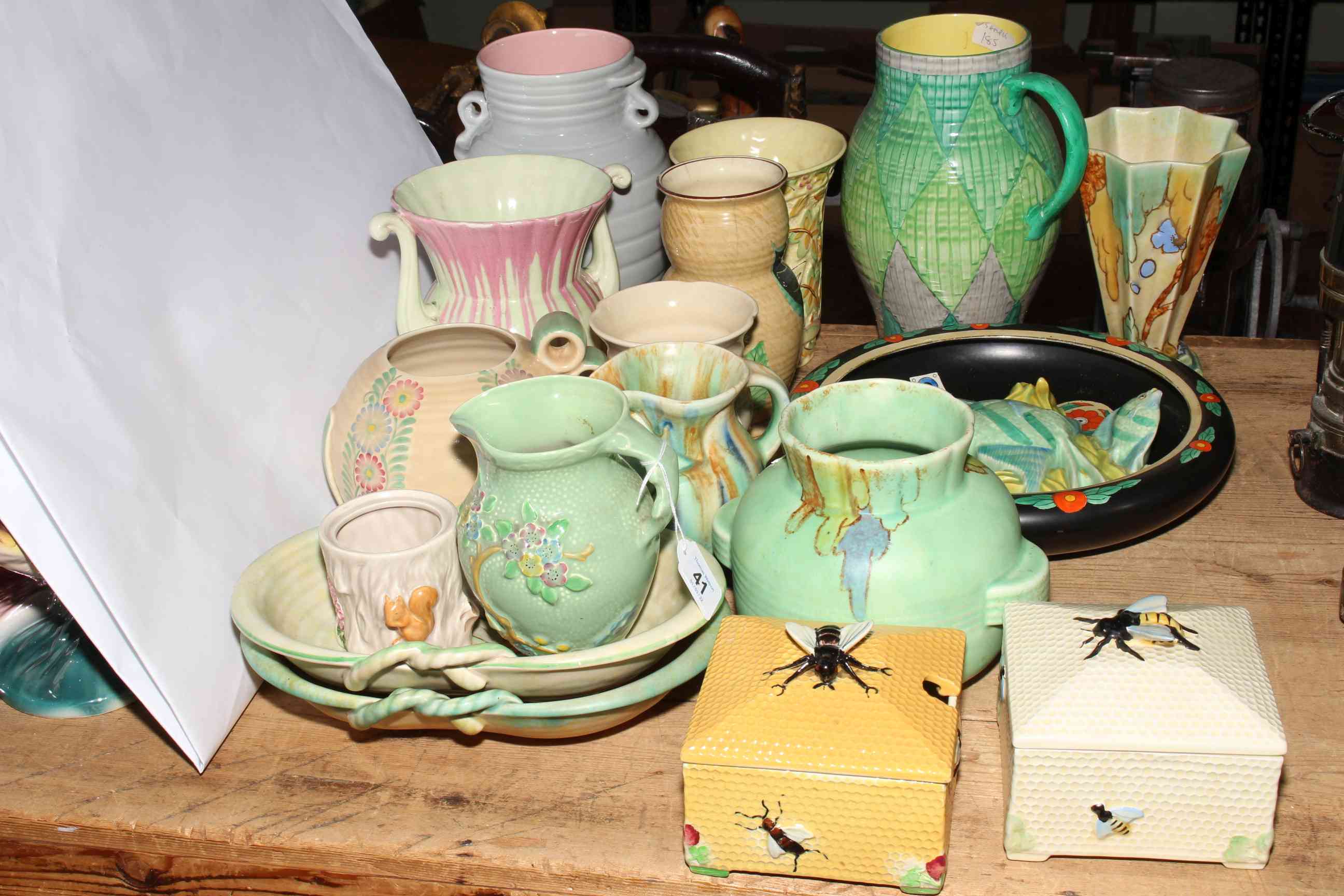 Collection of Crown Devon Pottery including vases, jugs, bowls, wall plaque and two preserve pots.