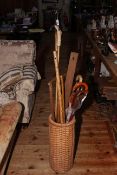 Wicker work stick stand and walking sticks.