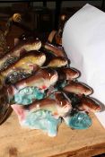 Nine Jema Holland Pottery lustre trout ornaments.