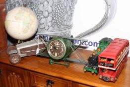 Four tinplate models, bus, car, locomotive and bi-plane clock and desk globe (5).